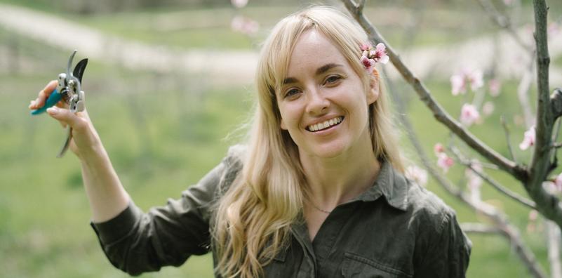 Woman holding small pruners